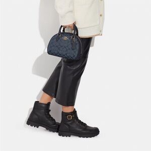 Coach Monogram denim barrel crossbody bag